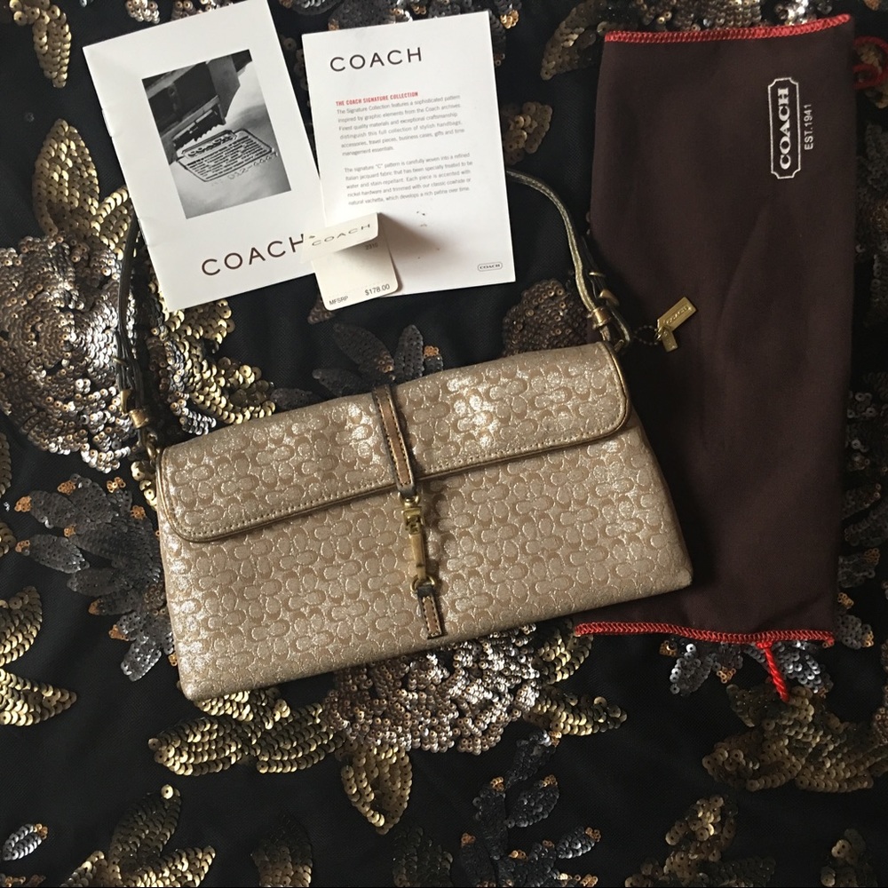 Coach gold and silver clutch purse.